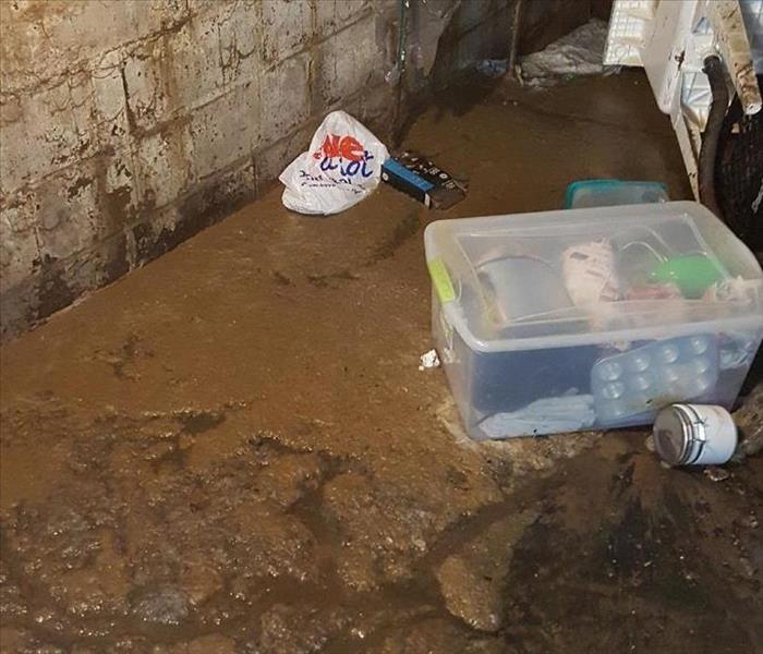 An unfinished basement in Stark County with an inch of raw sewage on the floor