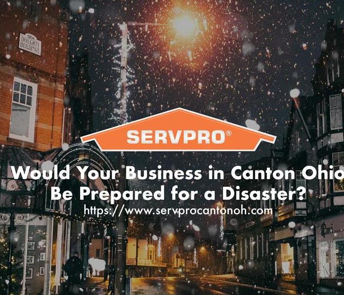 Orange SERVPRO  house logo on image of city in winter with snow. 