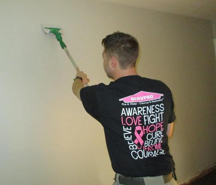 SERVPRO team member wearing a Pink SERVPRO logo to promote breast cancer awareness month within our community